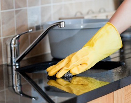 Staff maintaining tidy work area and safe chemical storage