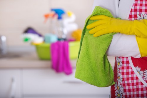 Technician using protective measures during carpet cleaning